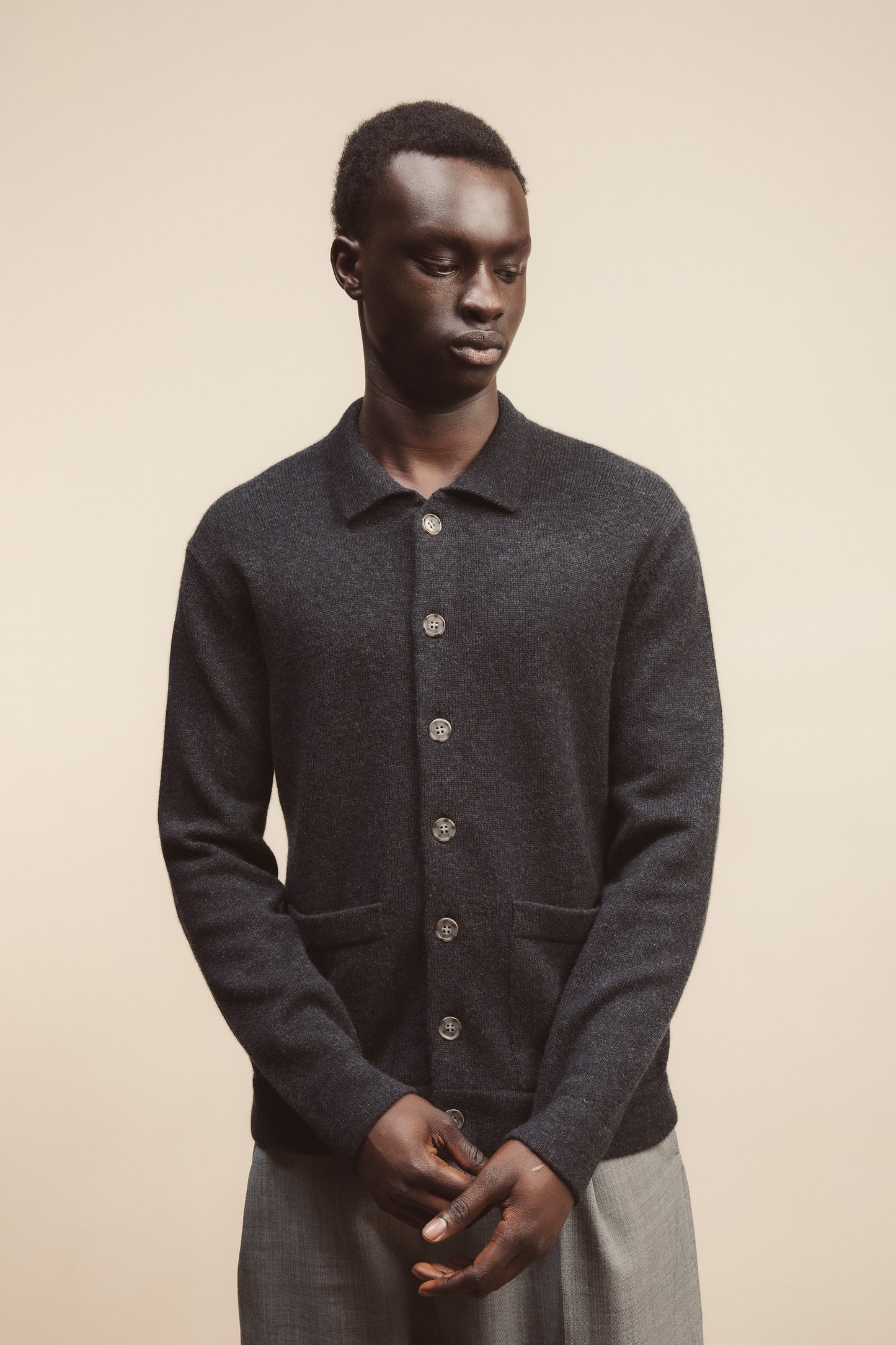 Person wearing the jacket standing in front of a creamy/beige backdrop